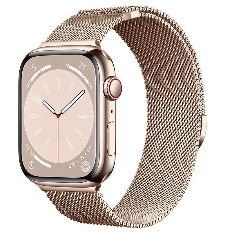 Gold Apple Watch strap in pink color made of stainless steel mesh lightweight, breathable and durable. Its metal clasp allows a precise and comfortable fit on the wrist. 
