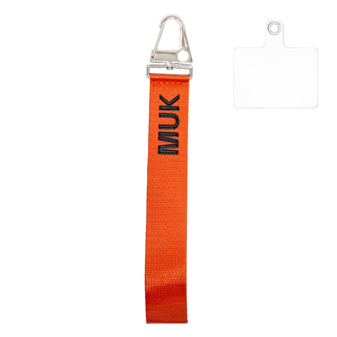 Cuerda universal corta de color naranja con logo MUK en negro.
 
*Adaptador universal incluido
