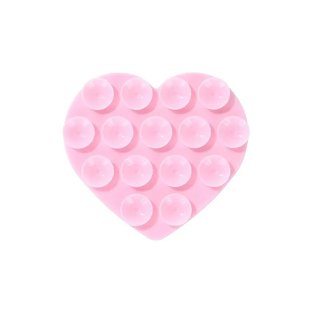 Heart-shaped silicone suction cups for phones with a strong 3M adhesive to stick on any cell phone or cell phone case, exclusive of the Laura Escanes x Muk collection.
